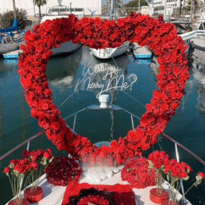 Proposal arch of roses with question's neon